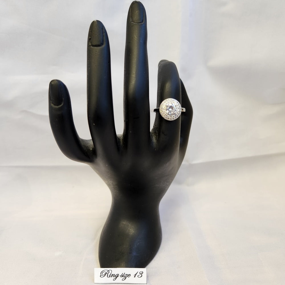 Stunning double halo ring displayed on a mannequin hand