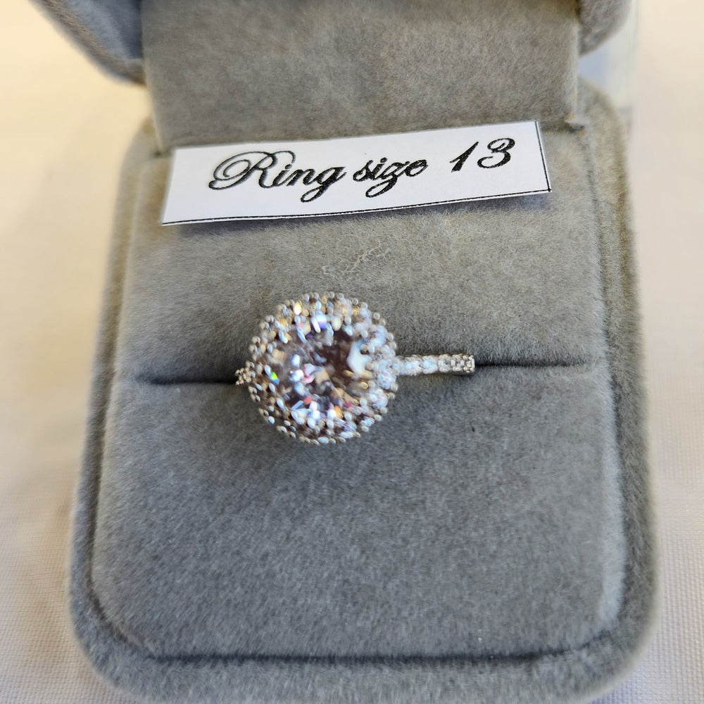 Detailed view of halo shaped ring with studded band