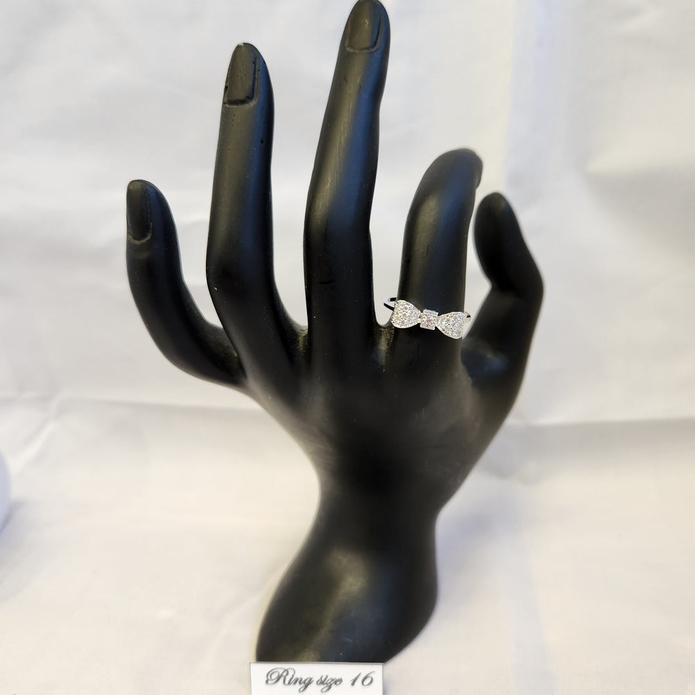 Bow shaped ring on mannequin stand