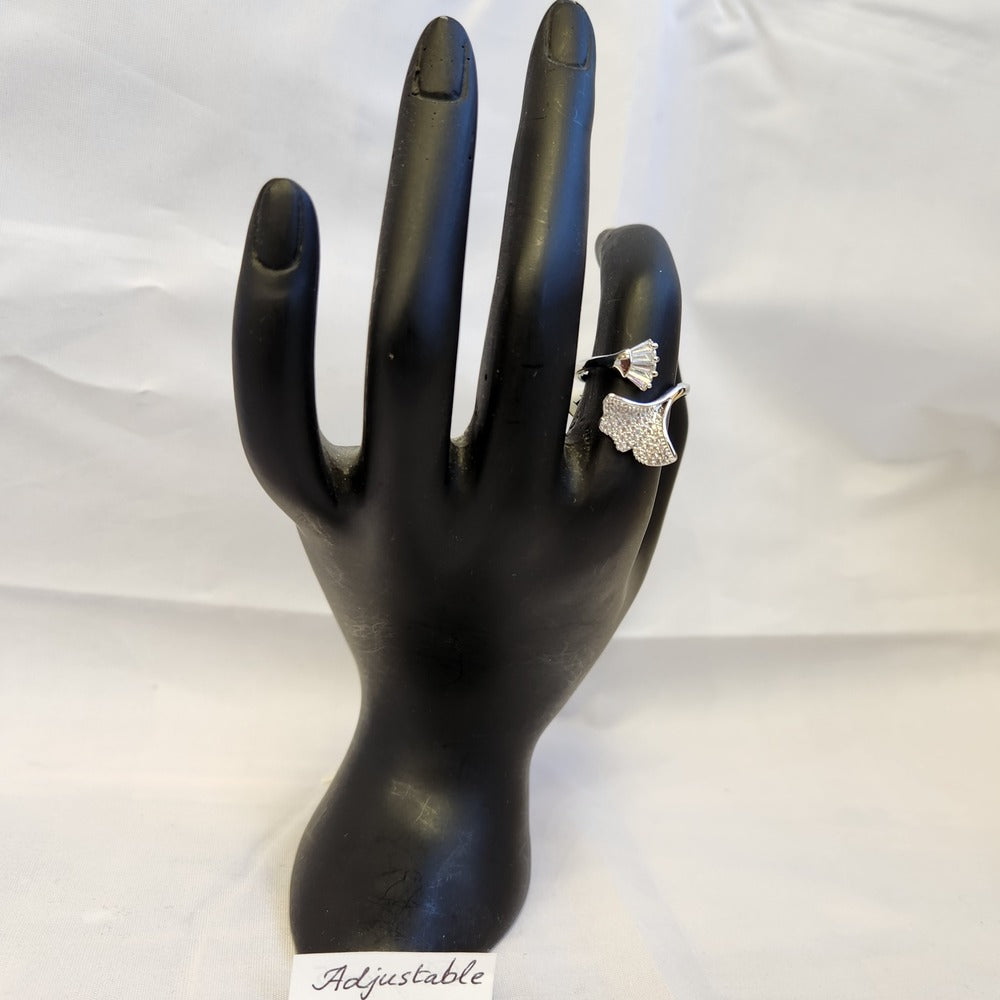 Adjustable leaf shaped silver colored ring on a mannequin stand