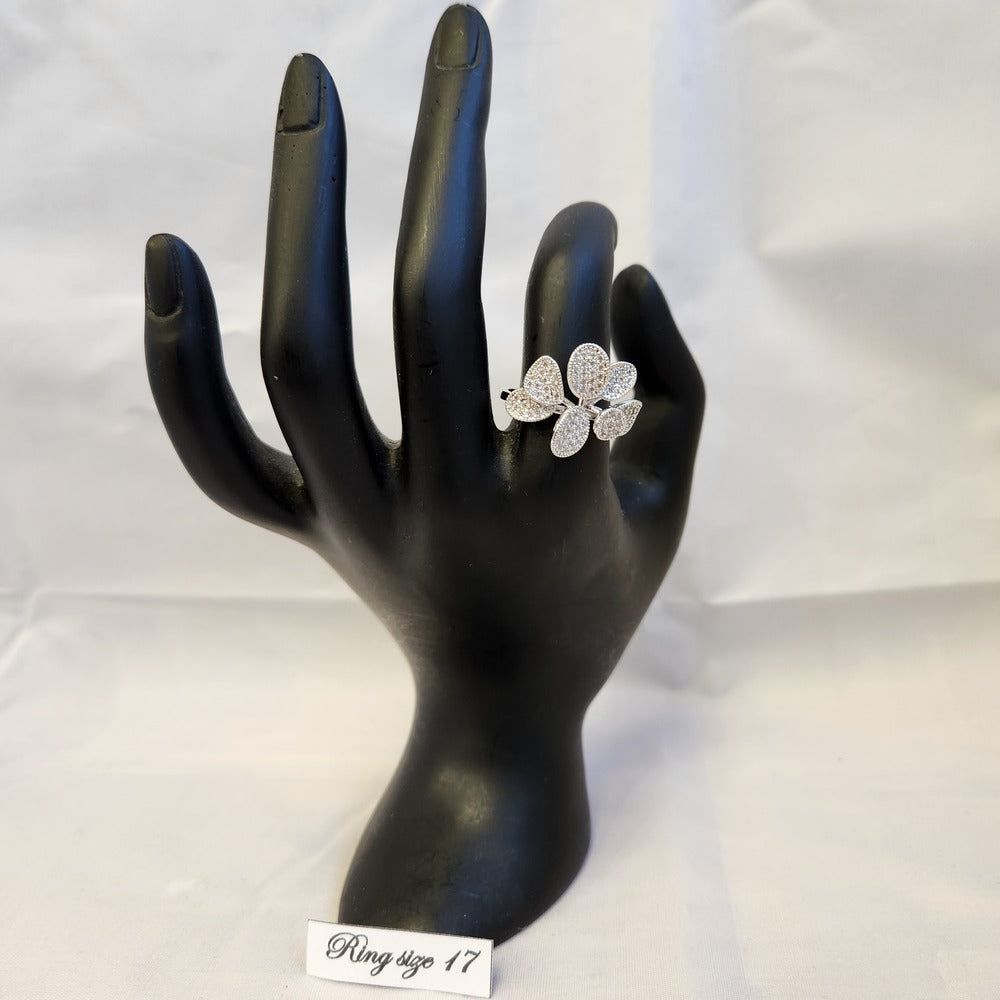Silver color floral ring on a mannequin hand