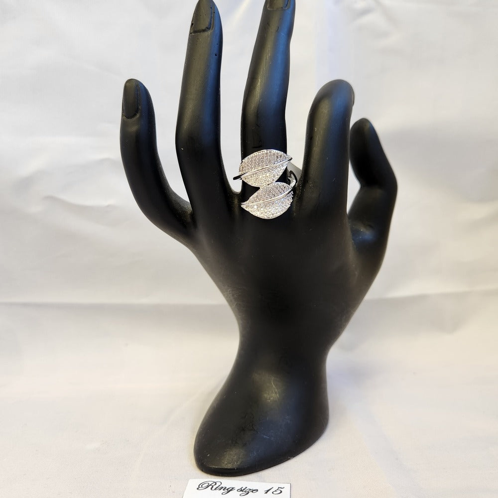 Elegant dual leaf ring displayed on a mannequin stand