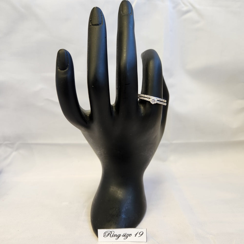 Silver color stackable ring set on mannequin hand