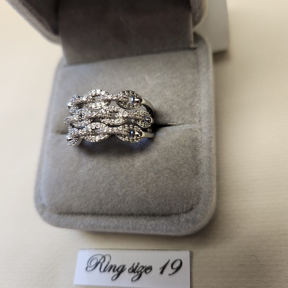 Detailed view of rope chain design wide band stone studded ring