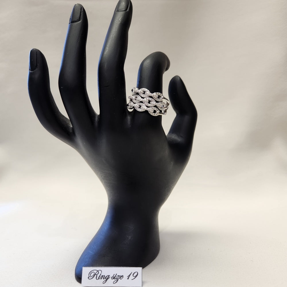 Rope chain design wide band stone studded ring on a mannequin stand