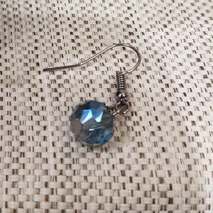Fish hook earrings offered alongside multistrand beaded necklace