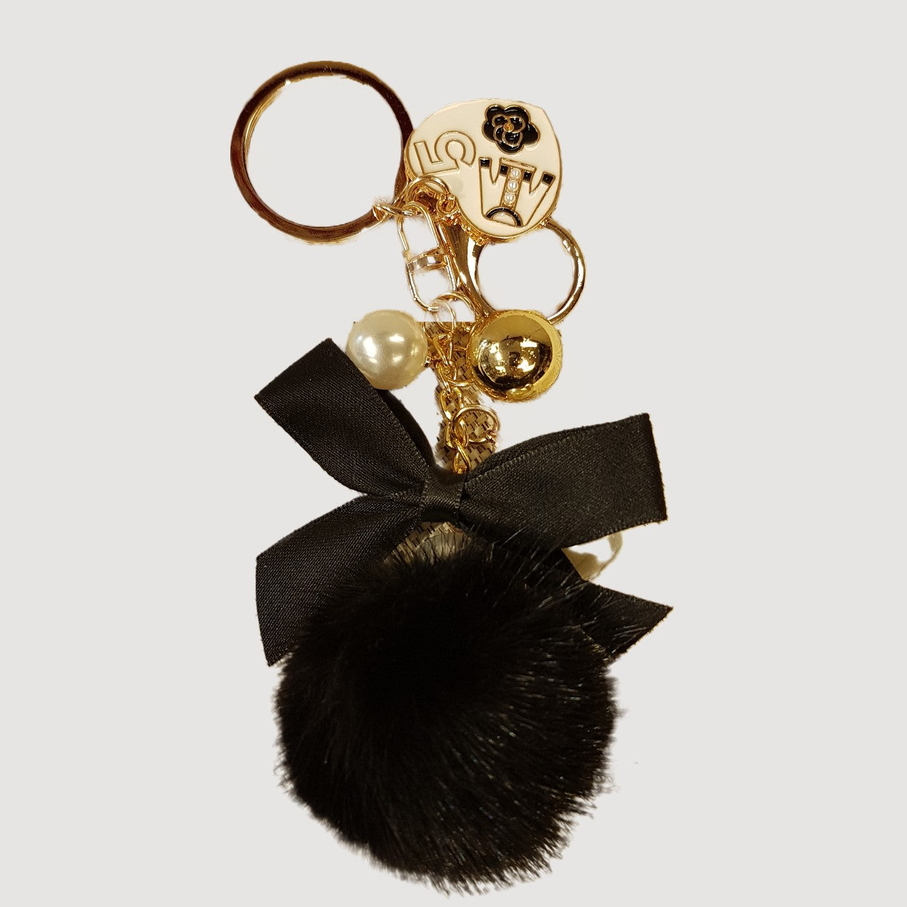 Purse charm with bow and pom pom