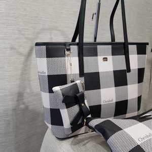 Pouch adorned with bow tie