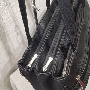 Detailed view of triple zipper compartments