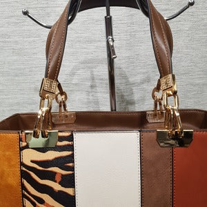 Gold color hardware on Fashion handbag with colorful panels and brown wallet