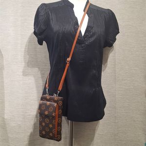 Small side bag in brown and tan print