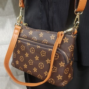 Tan colored strap on floral design side bag