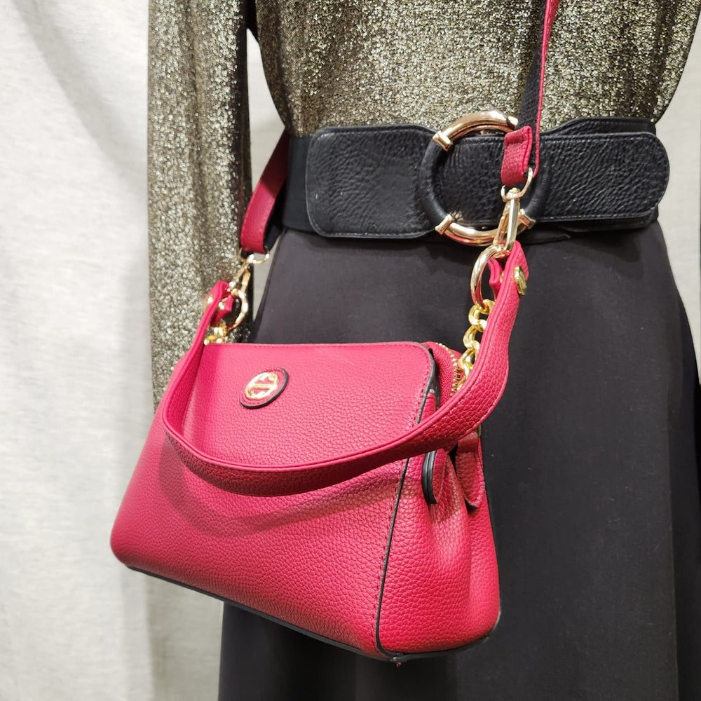 Detailed view of red side bag with two straps