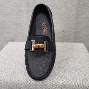 Front view of black color loafer with gold color fancy buckle