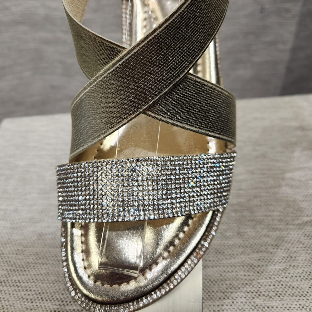 Detailed view of the front of gold summer sandals