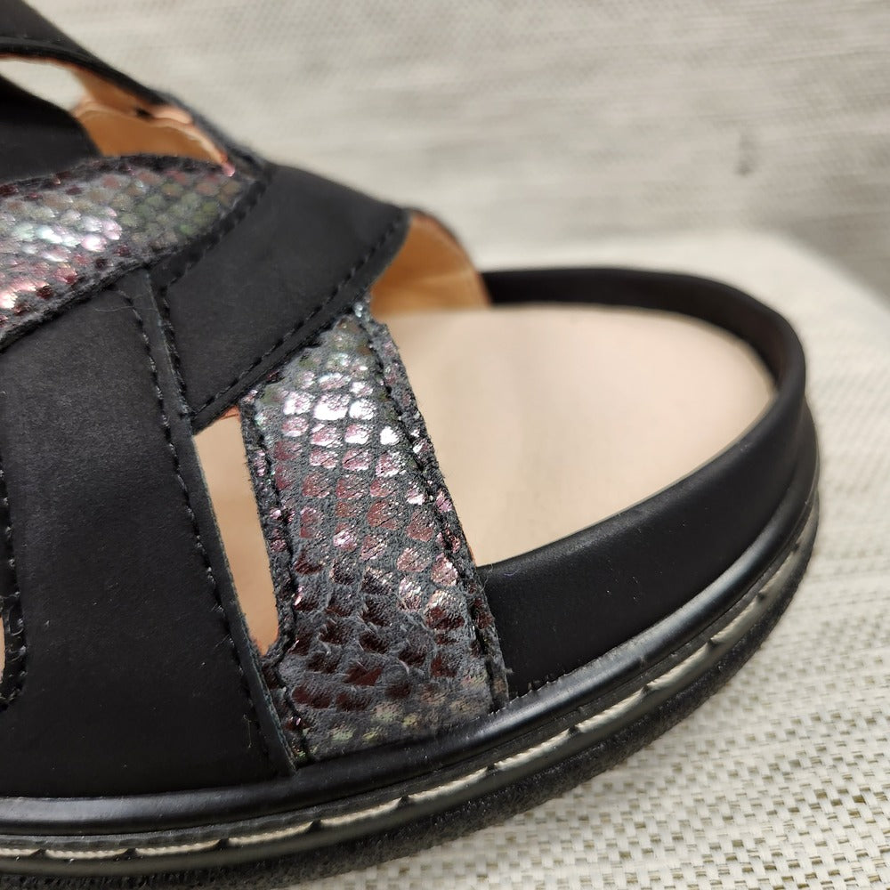 Deep cupping feature of black and grey sandal