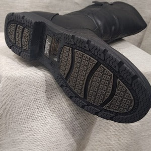 Sole details of Black color winter boots for women with side zipper