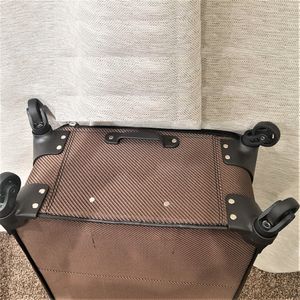 Four wheels under each piece of brown colored luggage set