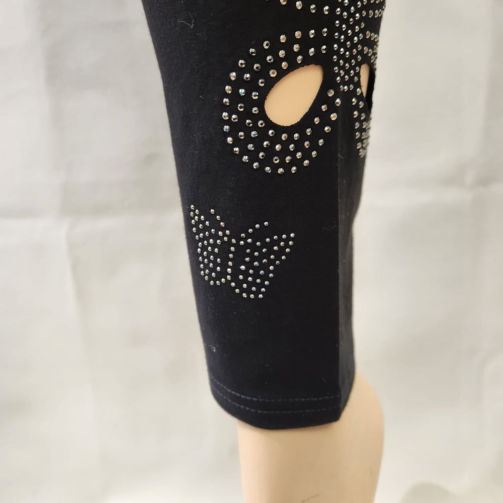 Another view of cut out butterfly pattern on black leggings