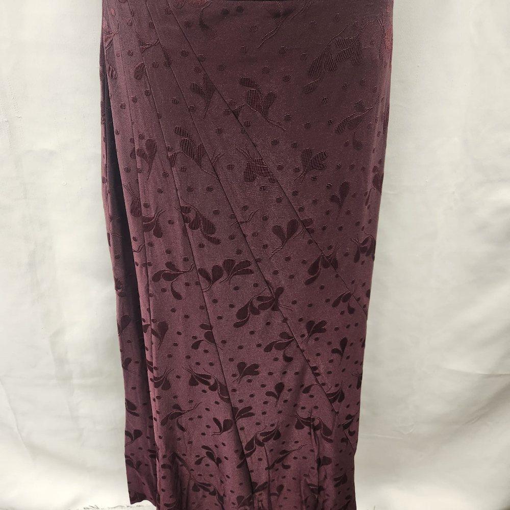 Asymmetric panels of burgundy self print skirt