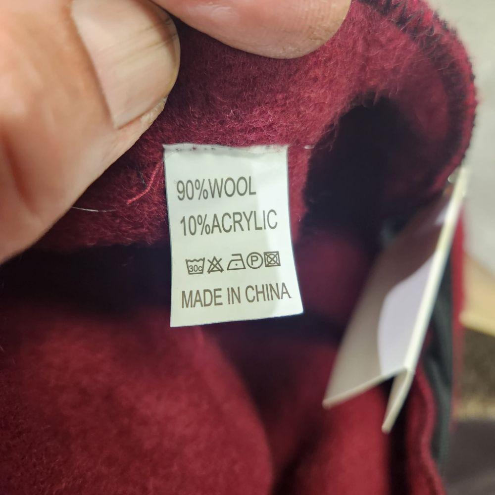 Inside tag on French beret cap in burgundy