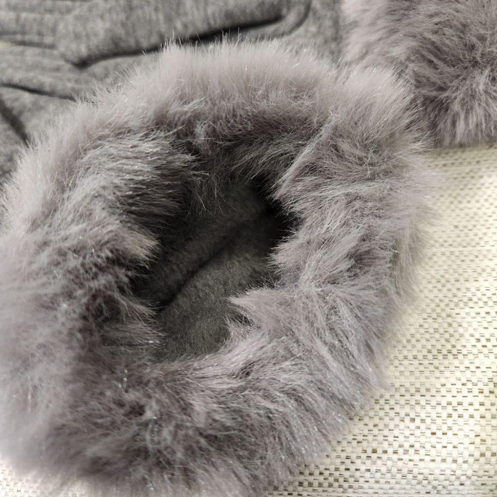 Detailed view of the grey fur trim