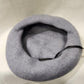 Inside of French beret cap in light grey