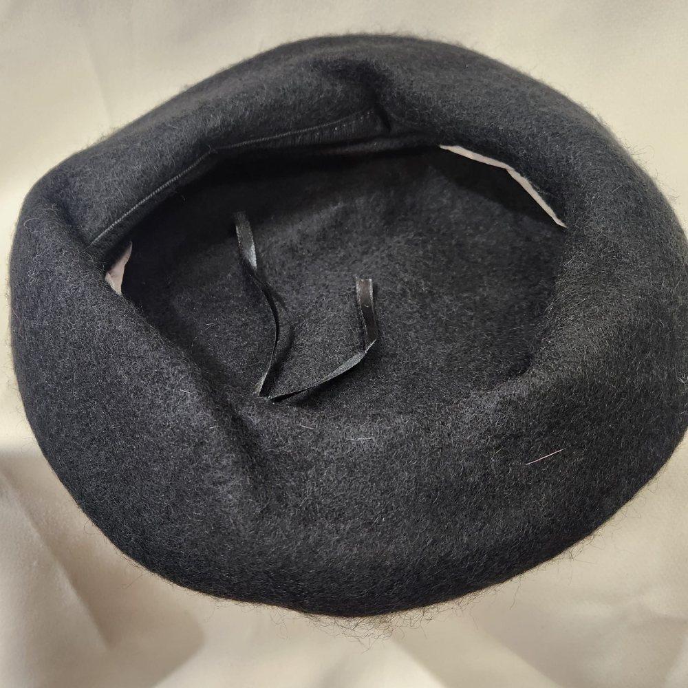 Inside view of French beret cap in black color