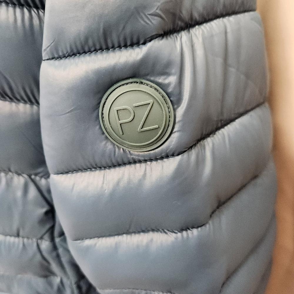 Point zero logo on the arm of pond blue jacket