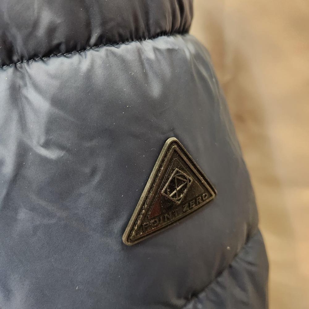 Point zero logo on the arm of navy winter puffer jacket