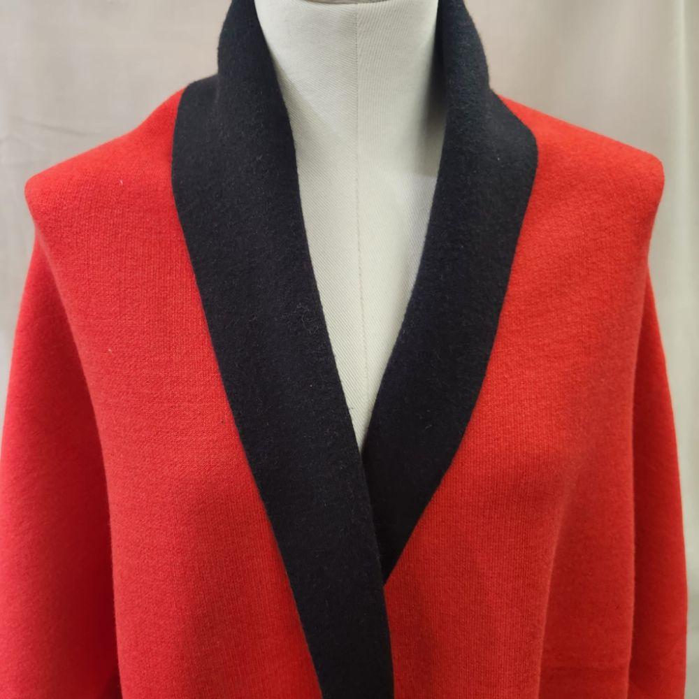 Closer view of the Reversible cape with red side up