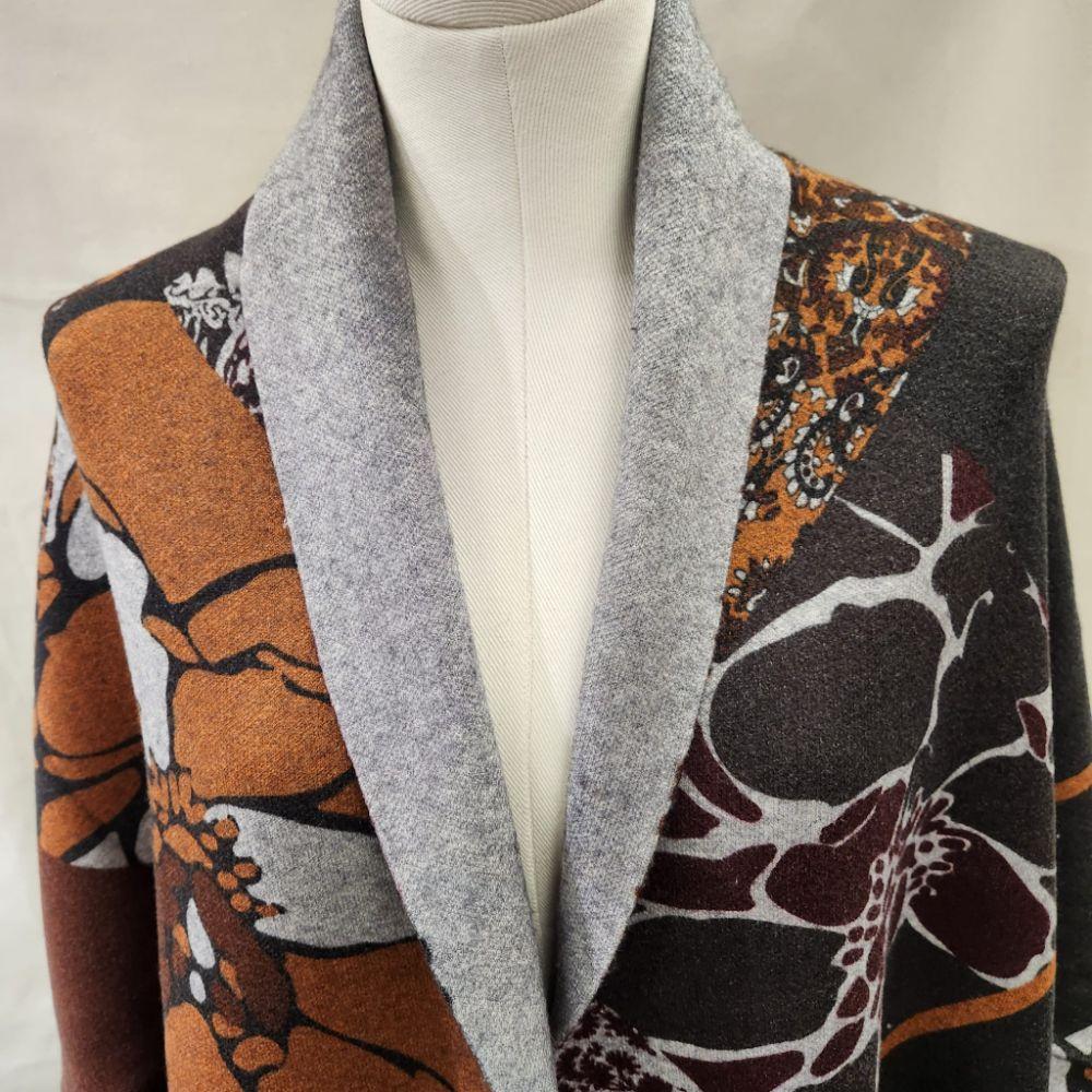 Detailed view of brown and grey shade printed reversible cape