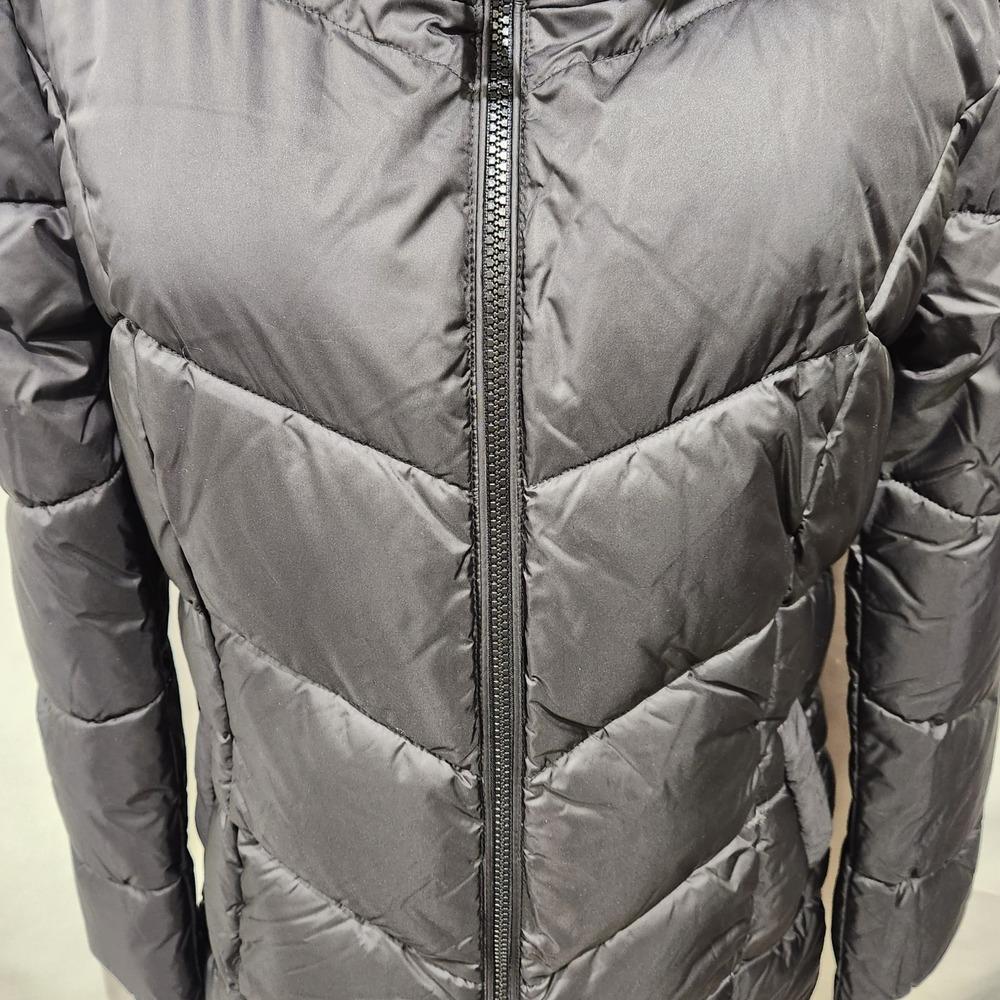 Zipper detail of black puffer jacket