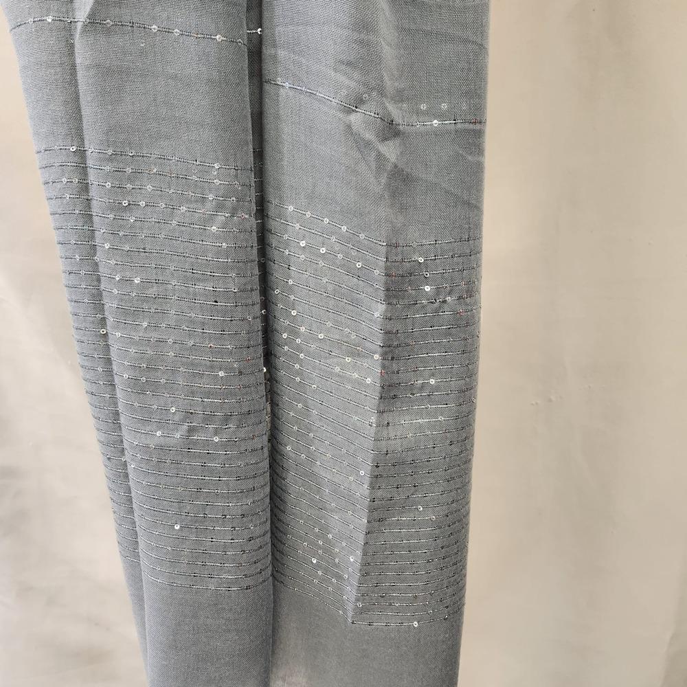 Detailed view of Grey summer scarf with light sequence detail