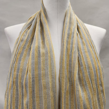 Light summer scarf with gray and dim yellow stripes