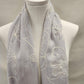 Detailed view of Light grey summer scarf with embroidery in white