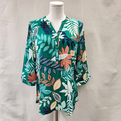 Front view of green summery print shirt for women