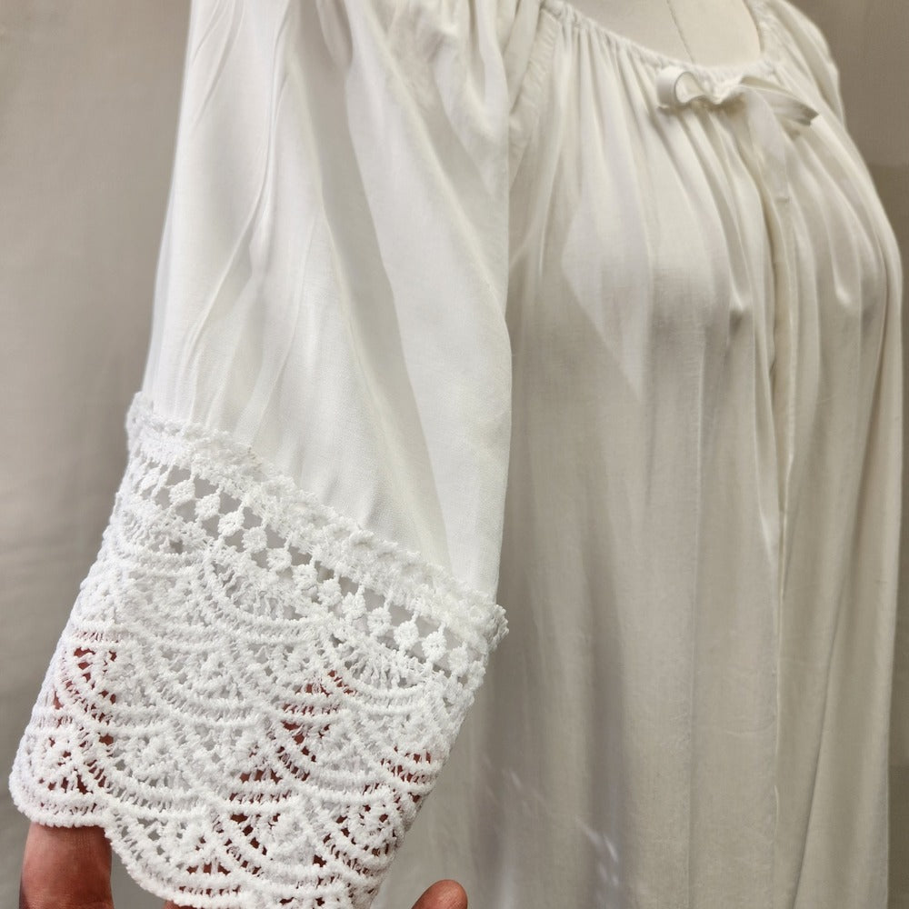 Lace detail on sleeves of white top