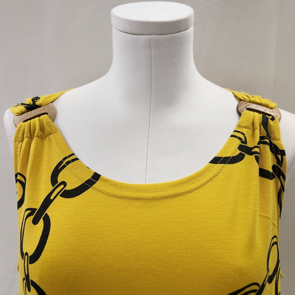 Round neckline with decorative detail close to shoulder of yellow colored top