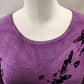Round neckline of printed knitted purple black top