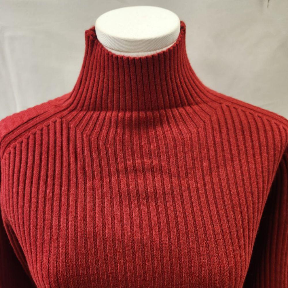 Turtle neck detailed view of red sweater