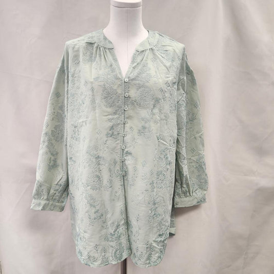 Front full view of Pistachio green buttoned front long sleeve top