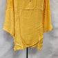 Layered and asymmetric hemline of yellow top