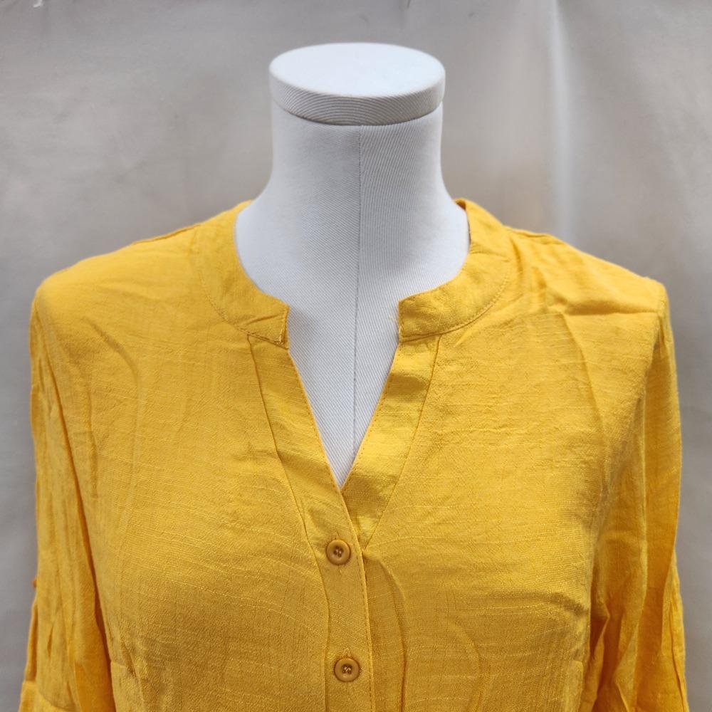 Notch neckline of layered yellow top