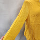 three quarter length sleeves of layered yellow summer top