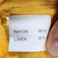 Material composition tag of yellow layered top