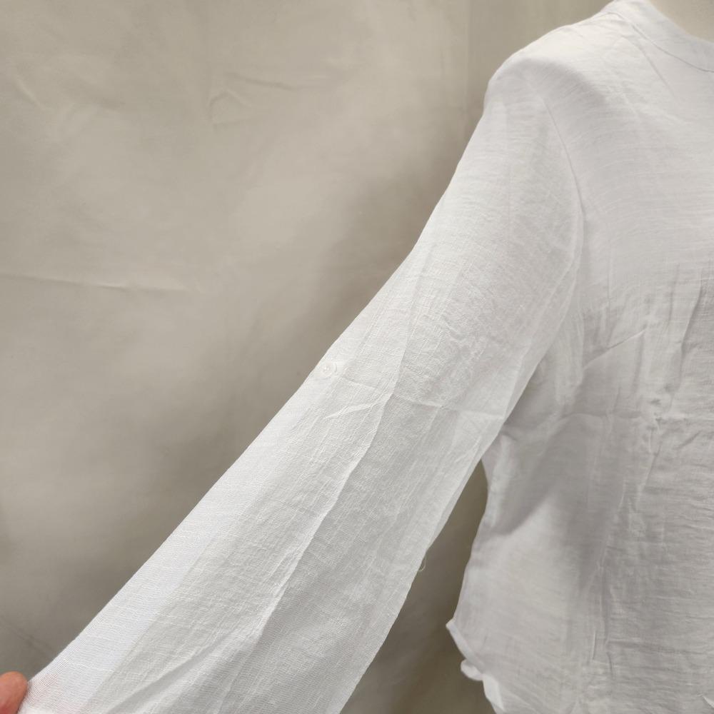 View of 3/4 sleeves of white layered top