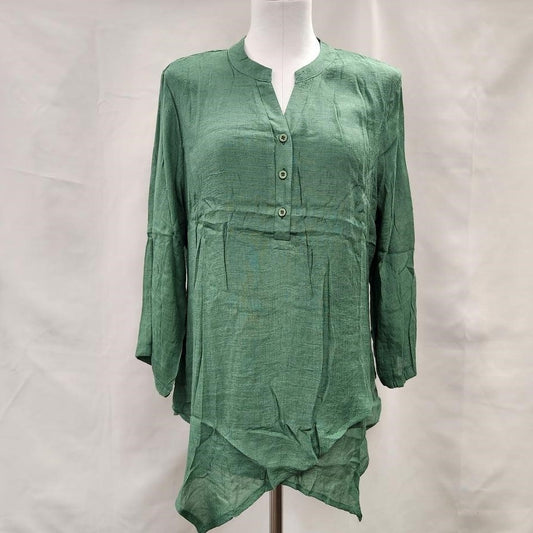 Full front view of layered green summer top with roll up sleeves