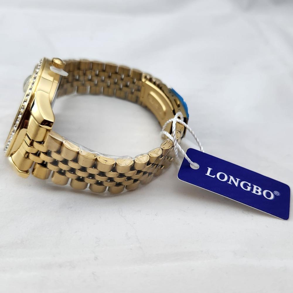 View of chain strap on gold frame wristwatch for men