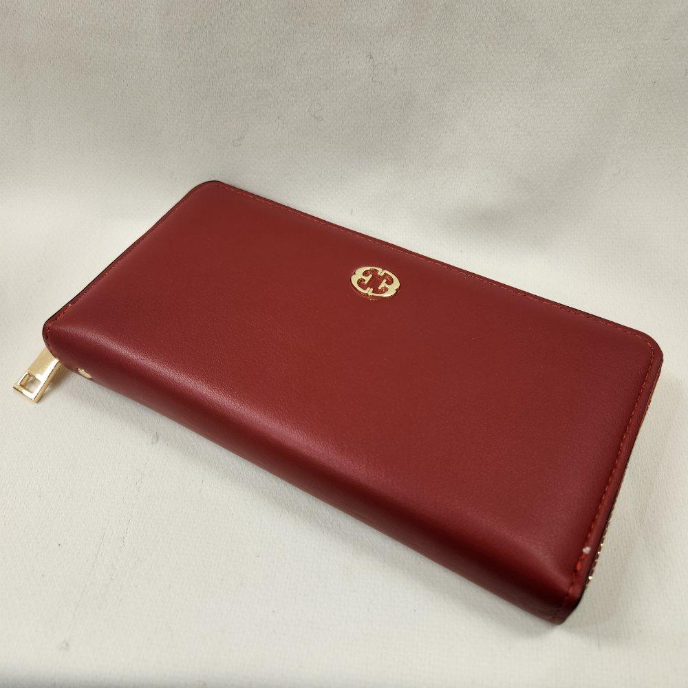 Red wallet with gold hardware